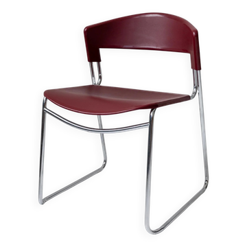 Vintage dining chair from the 1980s by Paolo Favaretto for Assisa, stackable, design Italy 1986 - chrome and red plastic - a classic of design.
