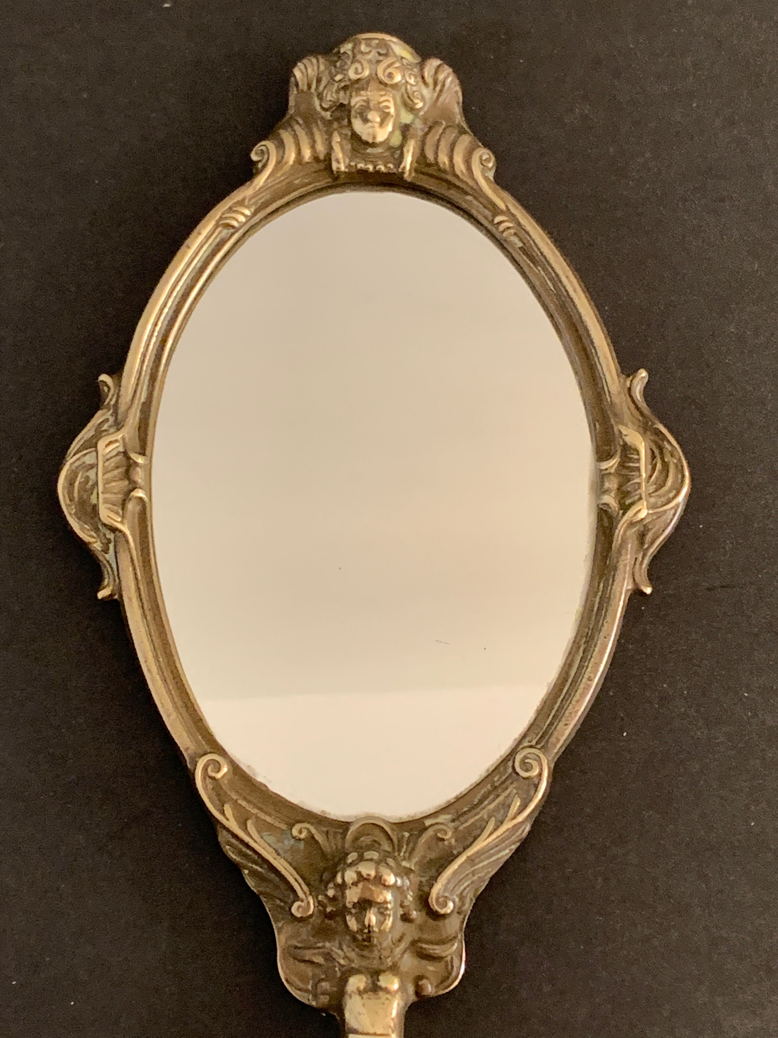 Bronze hand-facing mirror, early twentieth century, Louis XV style, 29 x 13 cm