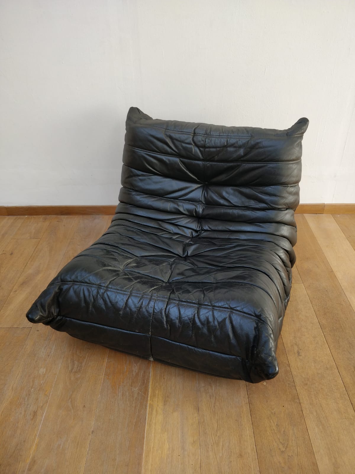 Togo in black leather by Ligne Roset
