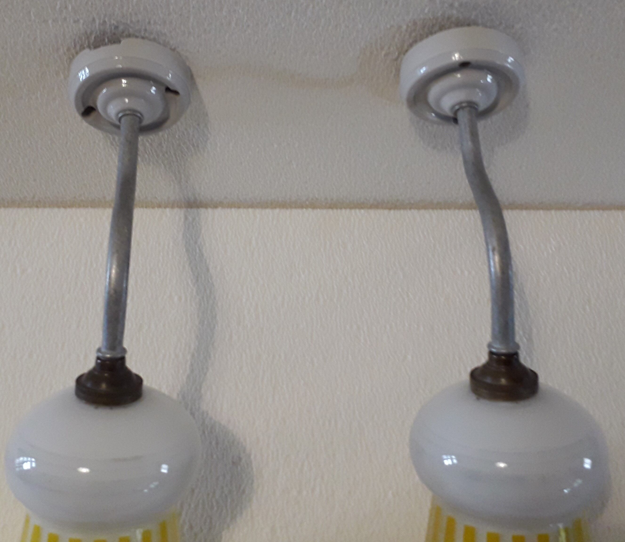 Duo of swan collar wall lamps