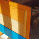 Wooden bed and vintage rattan