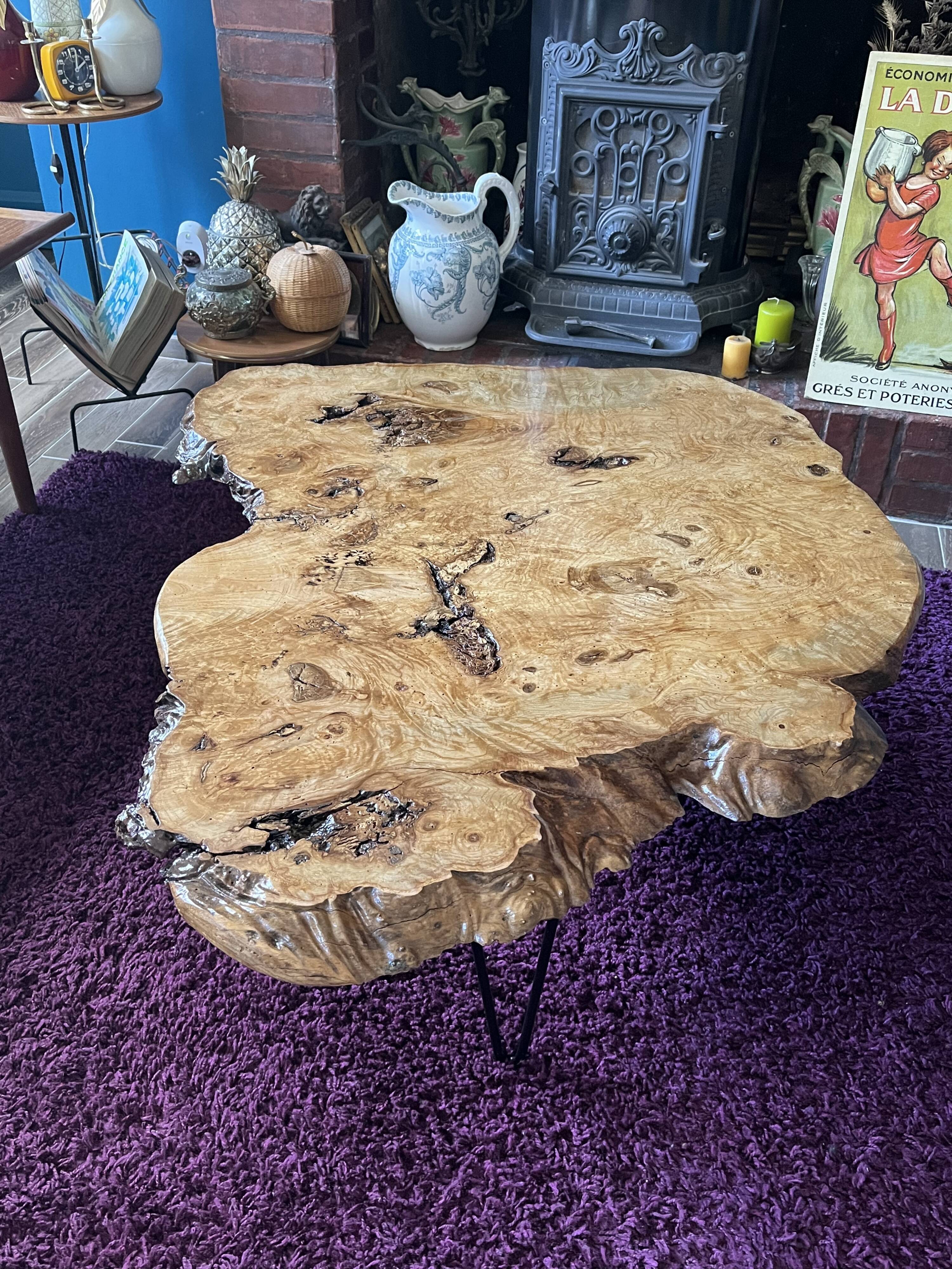 Tripod coffee table in natural solid elm magnifying glass