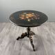 Napoleon III guéridon table in black lacquered wood with floral painted decoration, 19th century.
