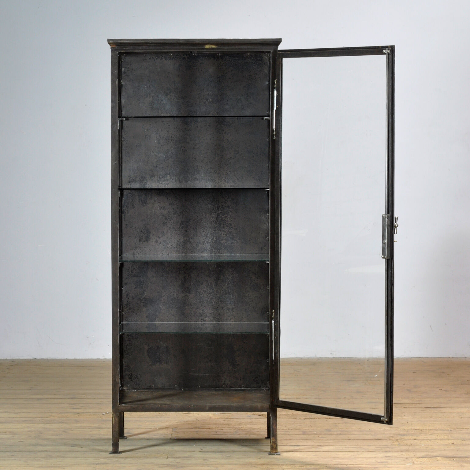 Polished iron medical cabinet, 1910s