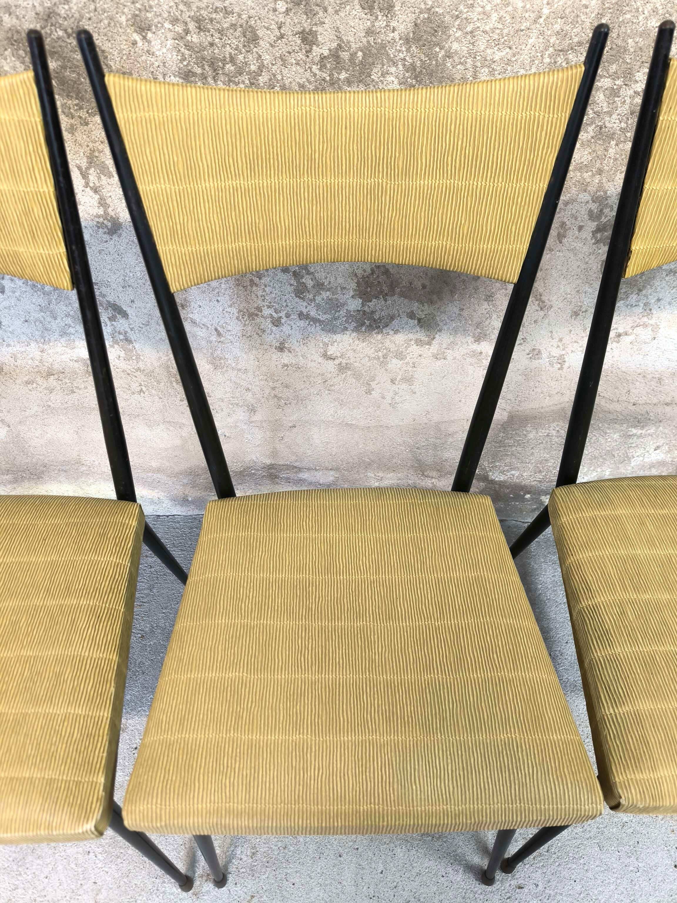 Three vintage chairs in the style of Colette Gueden.