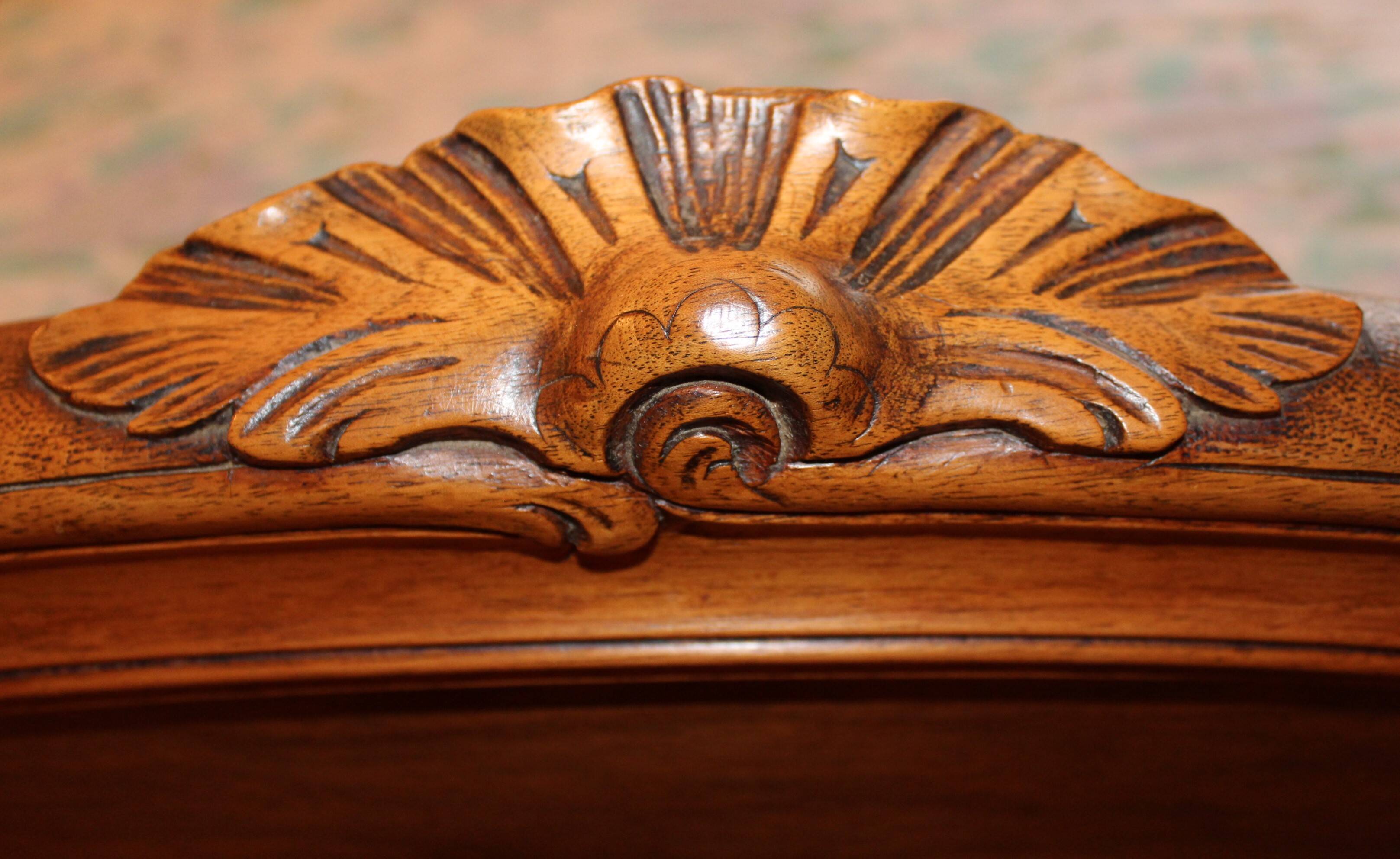 Walnut rocaille bed from the early 20th century.