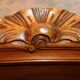 Walnut rocaille bed from the early 20th century.
