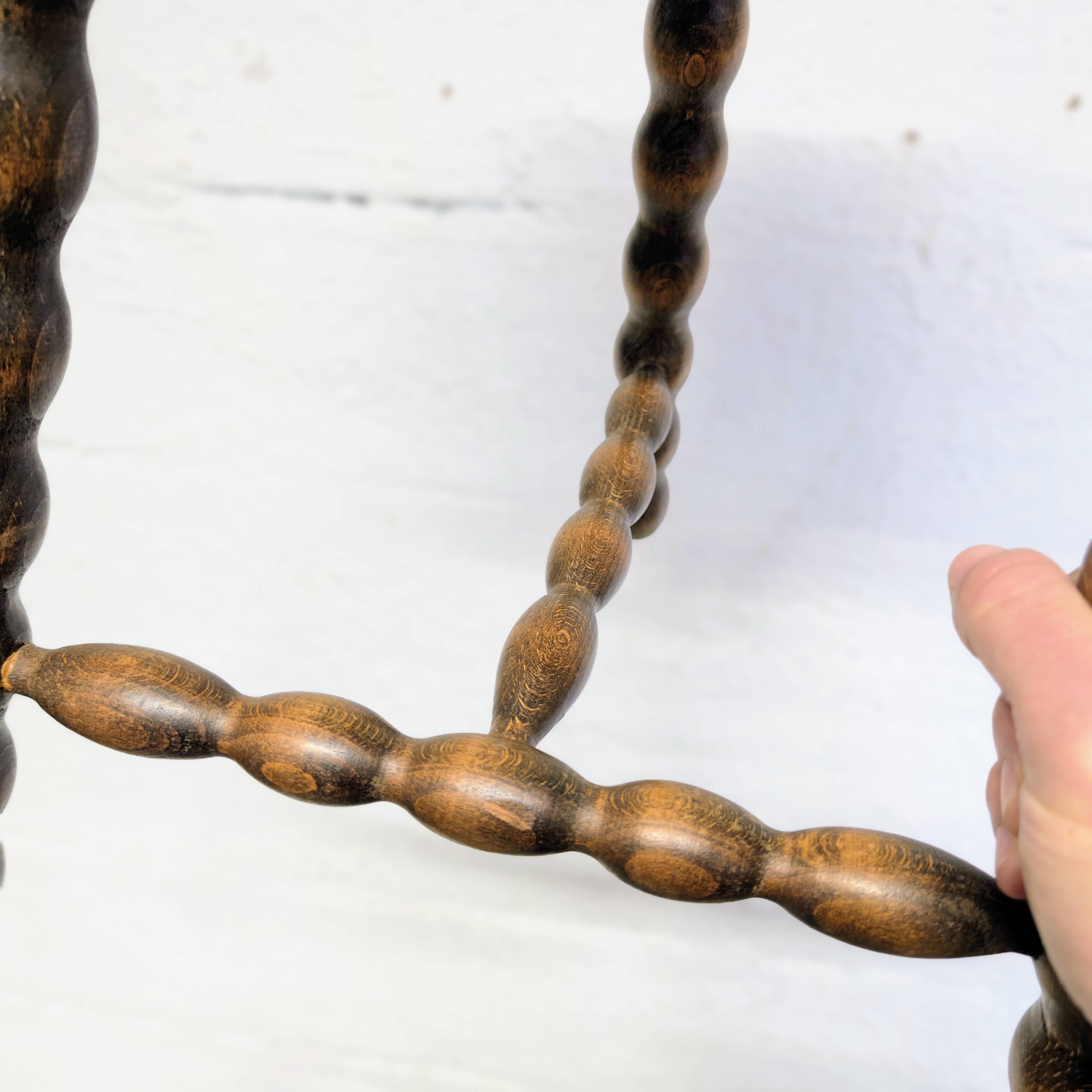 Turned wooden tripod stool