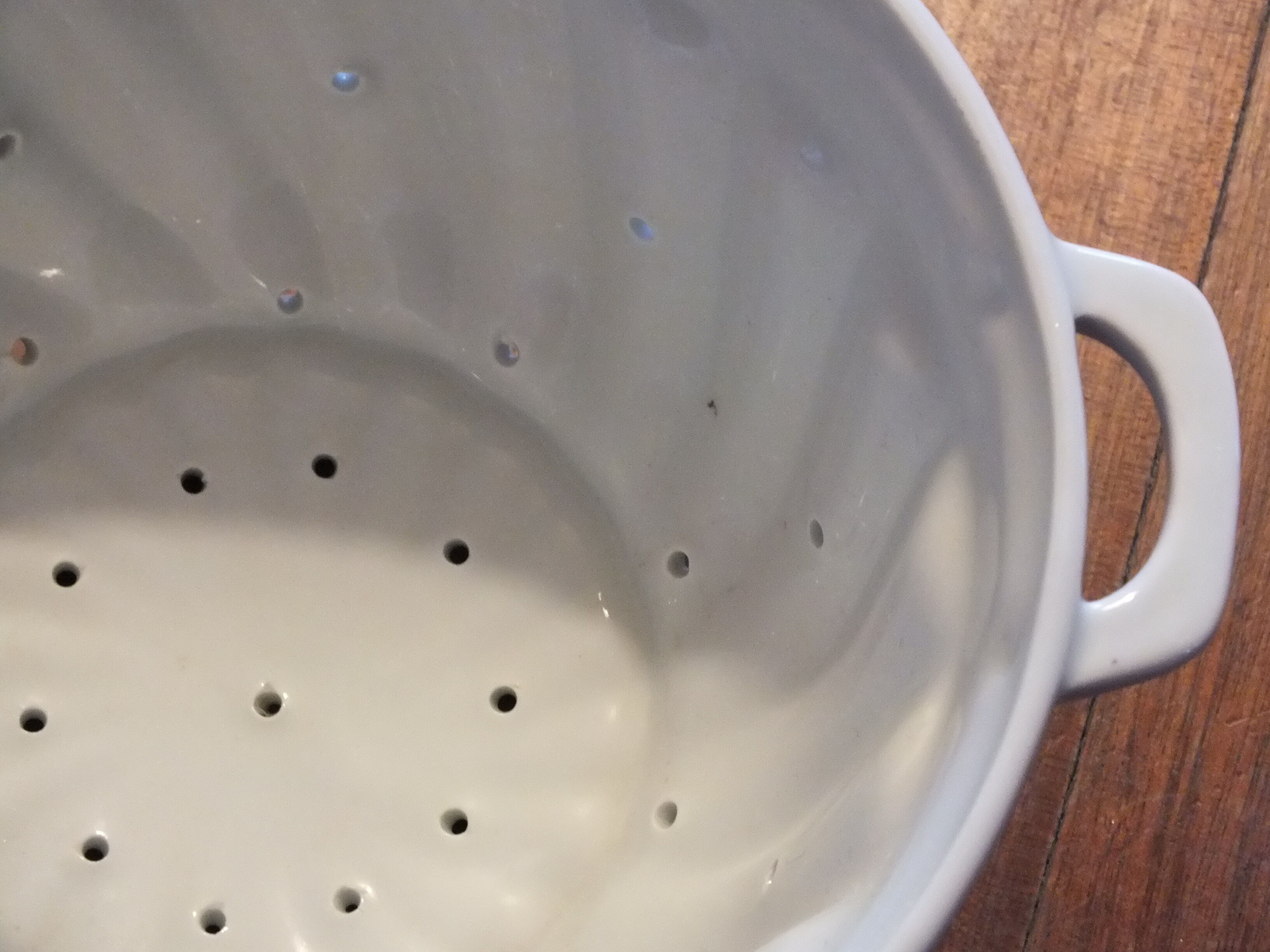 White porcelain strawberry strainer or drainer