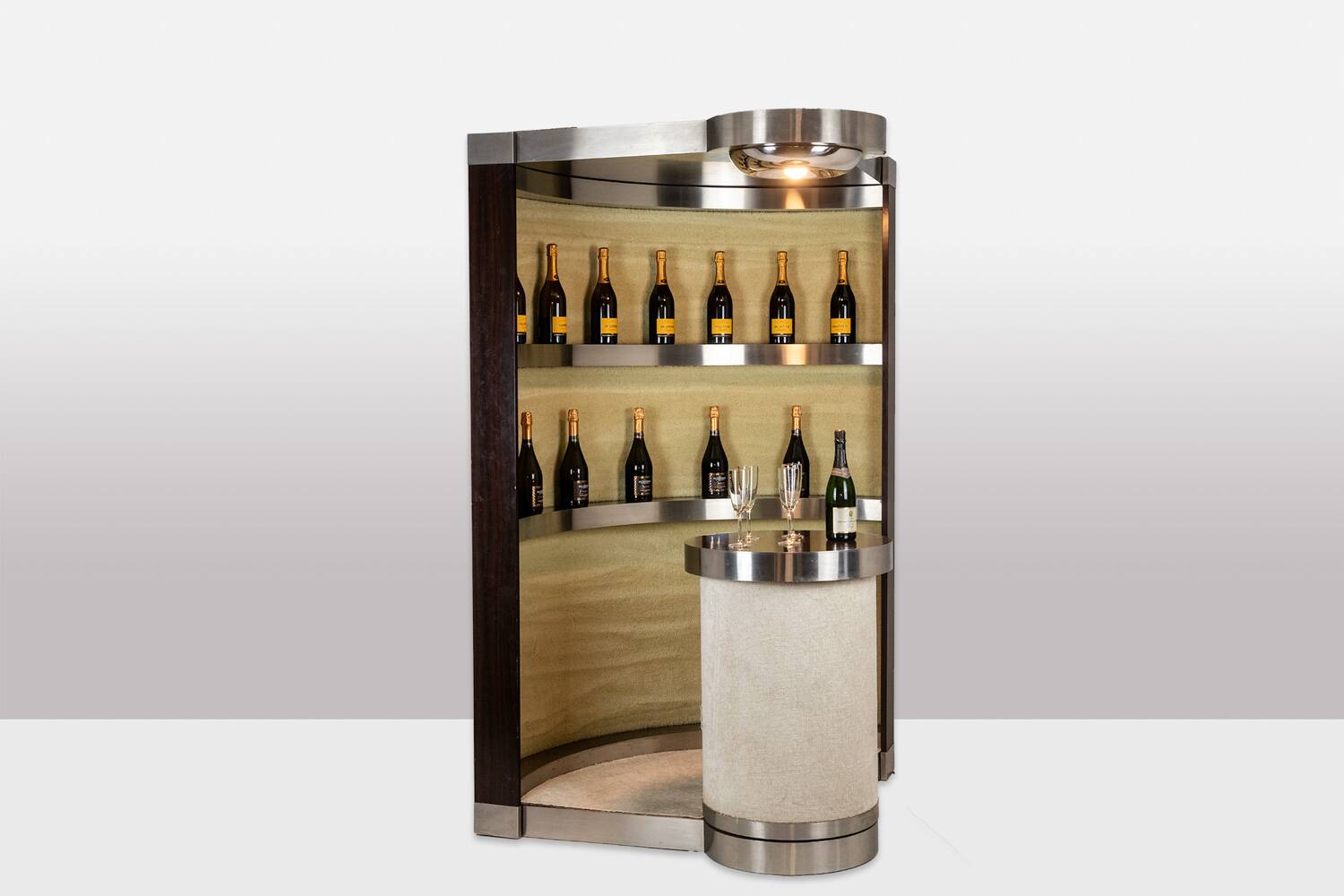 Circular bar in brushed metal, wood and carpet. 1970s.