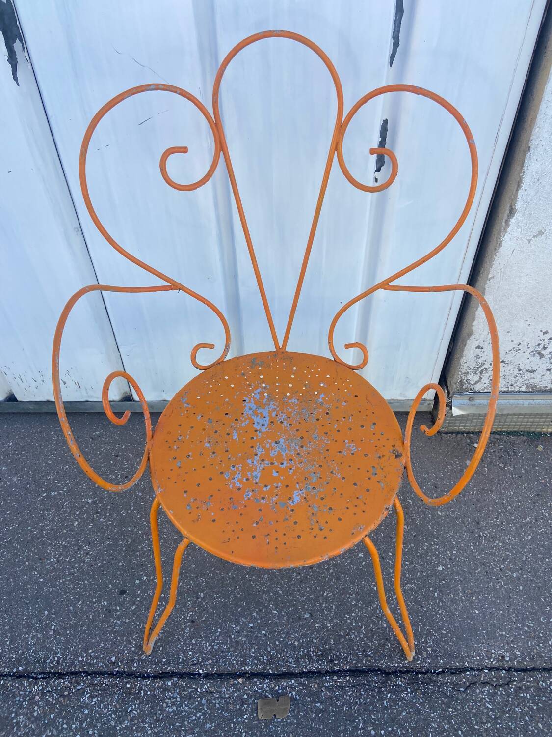 Orange wrought iron chair