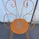 Orange wrought iron chair