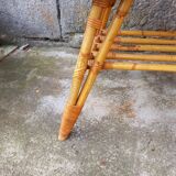 Rattan coffee table with compass legs