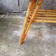 Rattan coffee table with compass legs