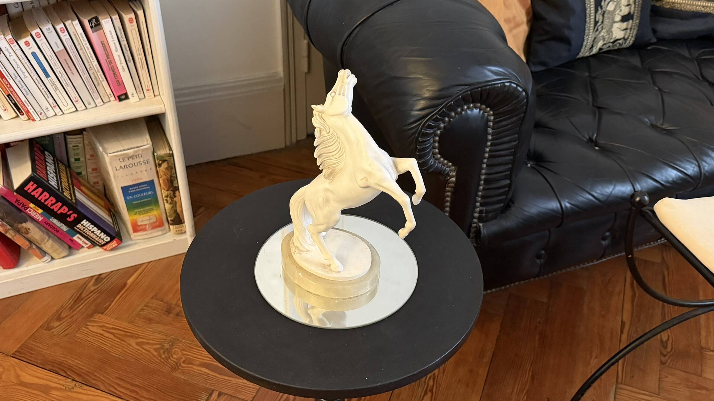 White rearing horse statuette