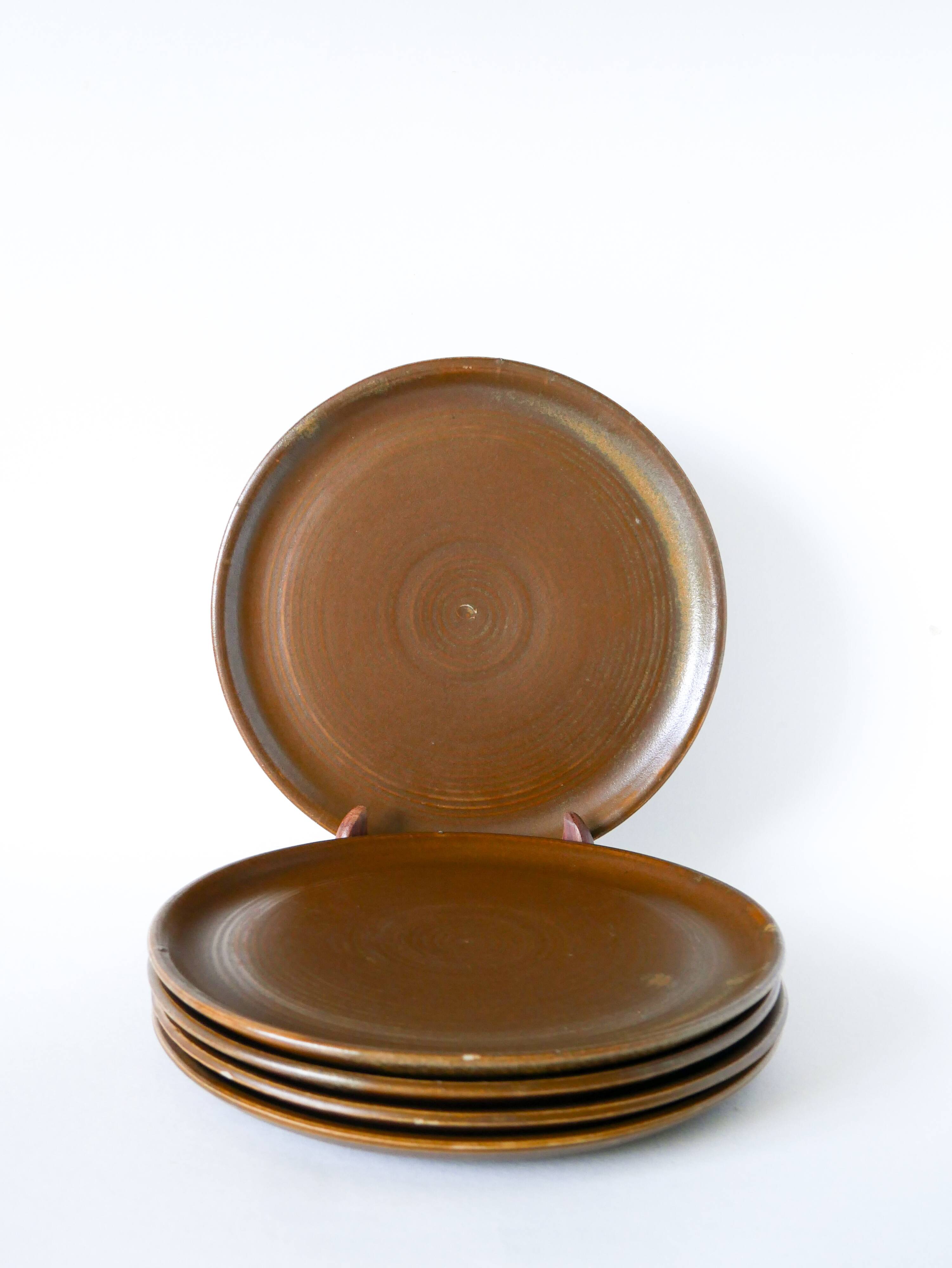 Set of 5 large flat plates in stoneware, 1970.