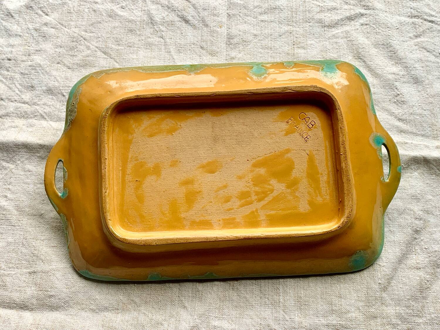 CAB turquoise and ochre ceramic dish with handles