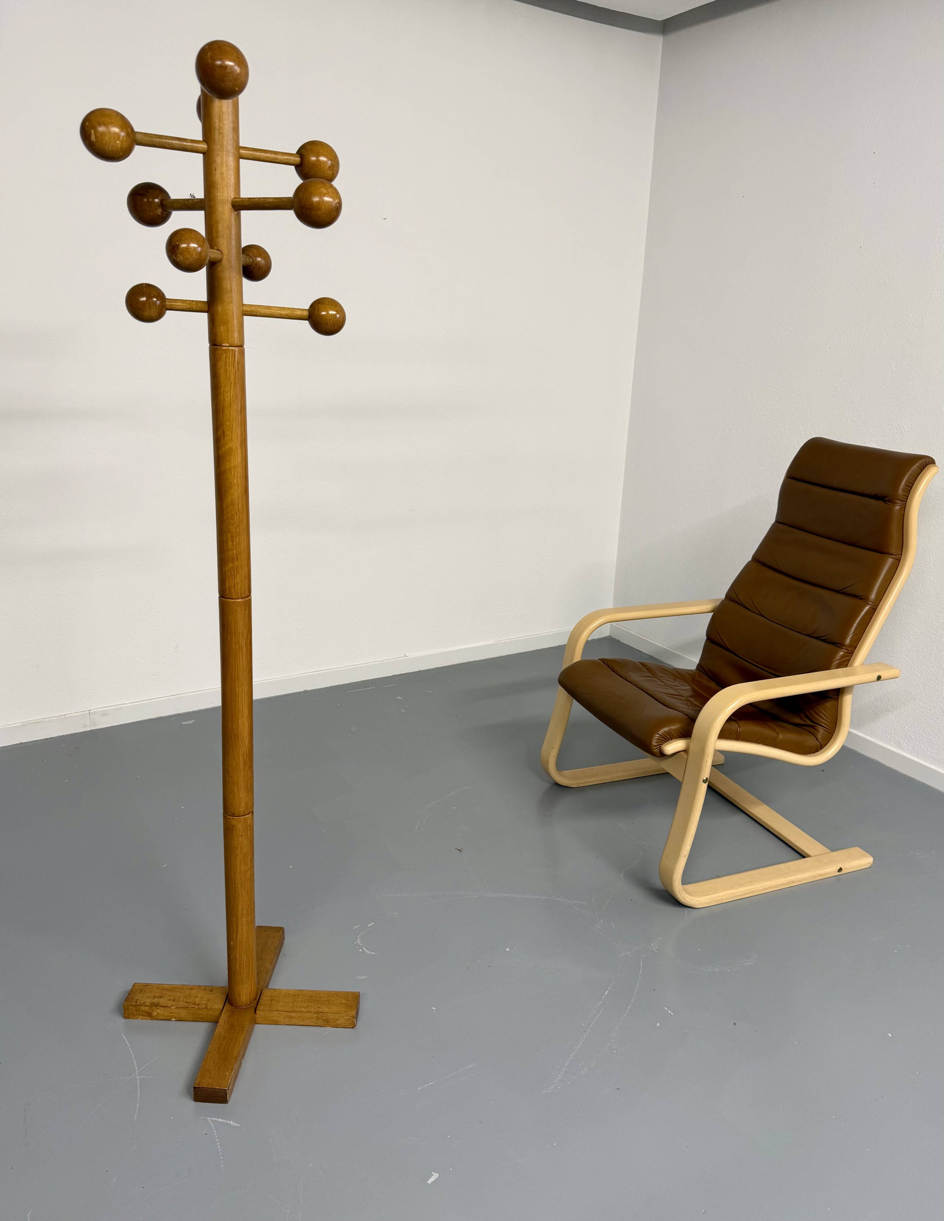 Vintage wooden coat stand with modernist design from the 1970s.