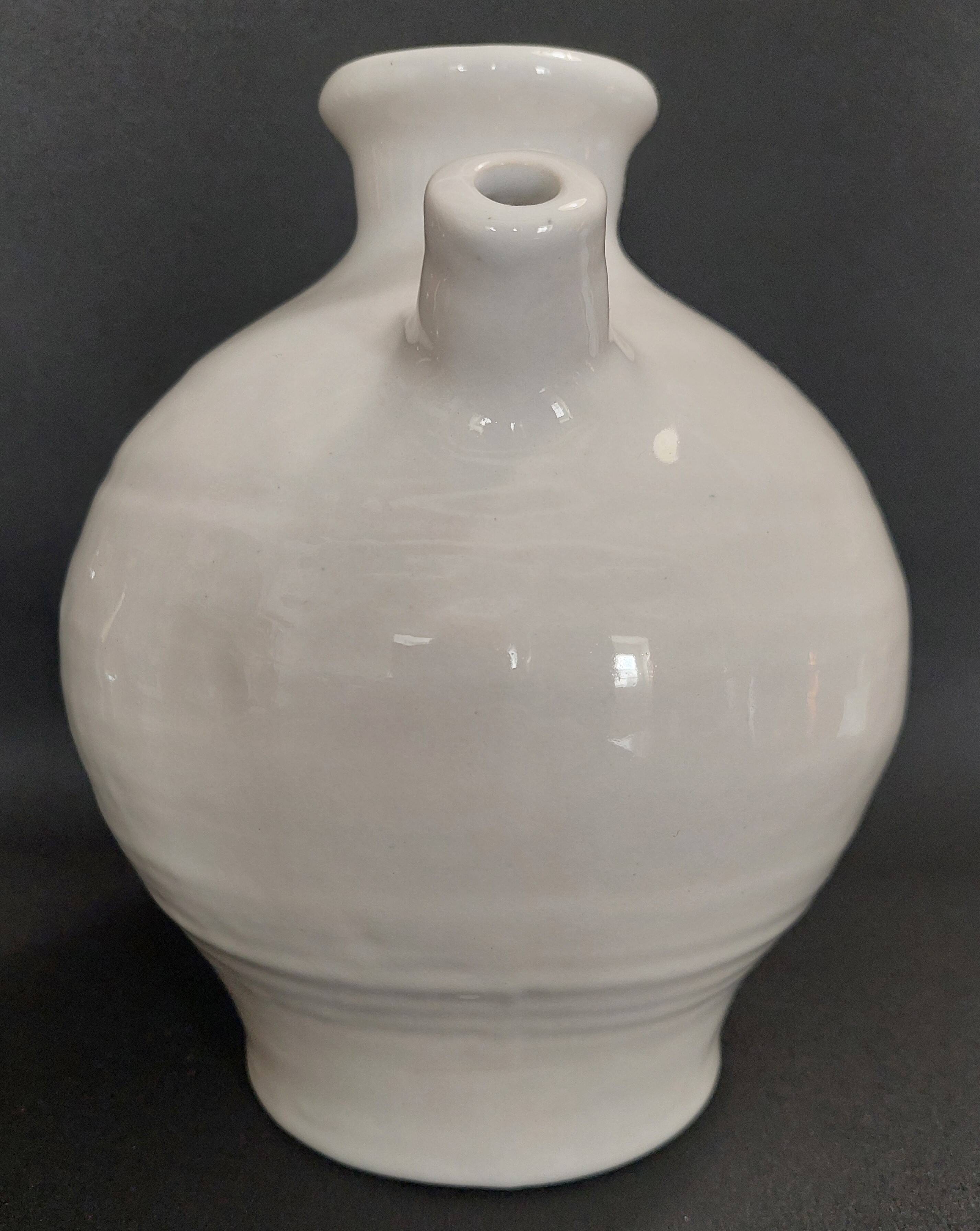 White ceramic goat-shaped creamer, first half of the 20th century.