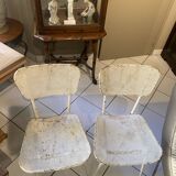 Pair of white metal chairs