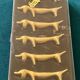 6 dog-shaped knife holders in fine gold-plated metal