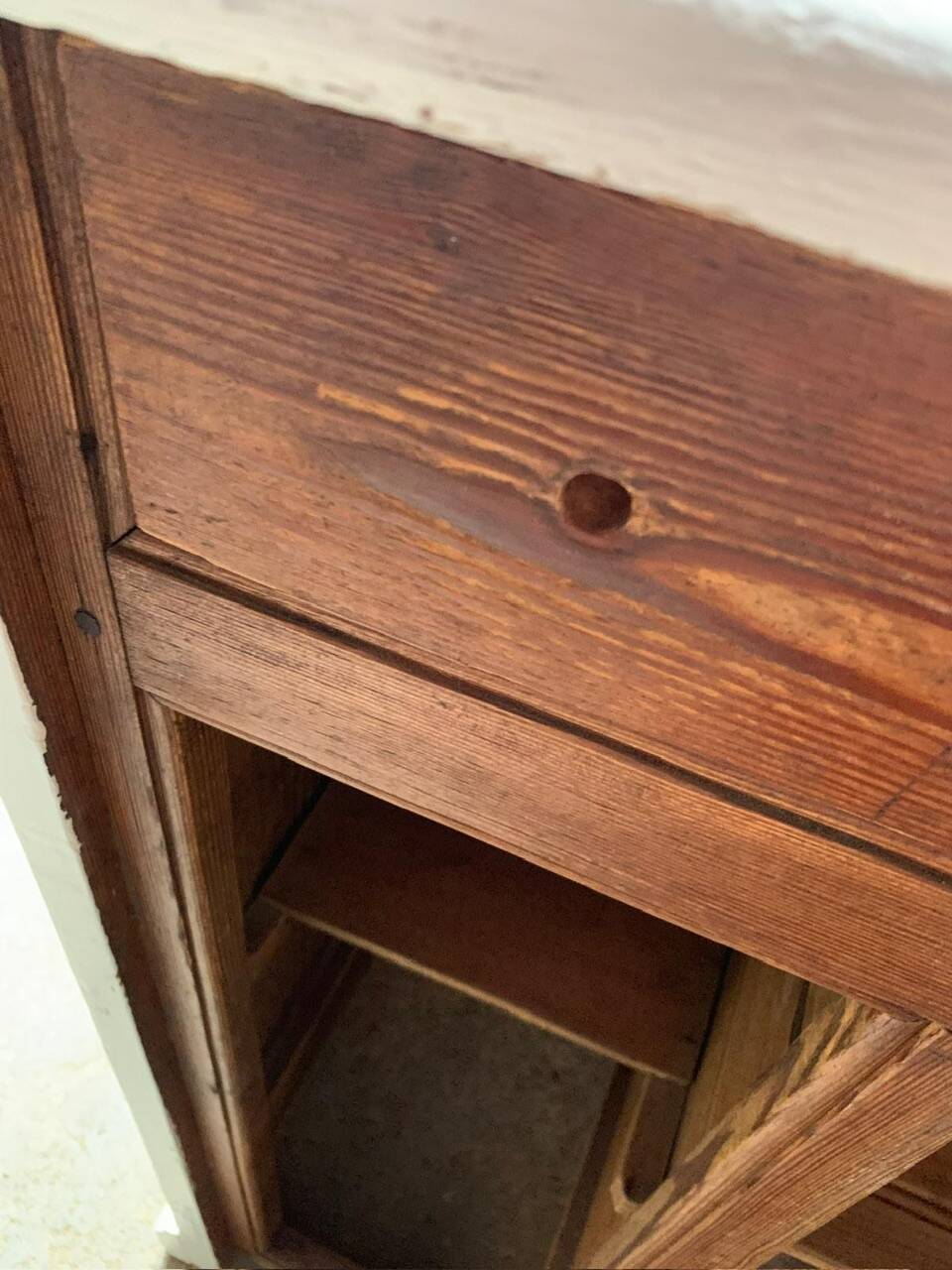 White counter with brass coin mechanism