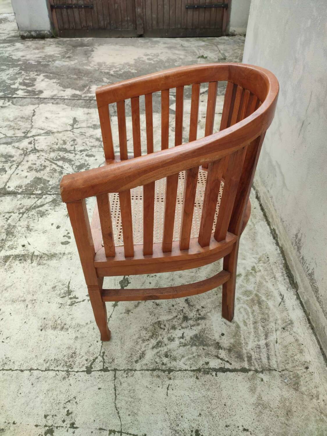 Old vintage teak wood cane armchair