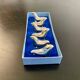 6 dolphin-shaped knife holders in silver-colored metal