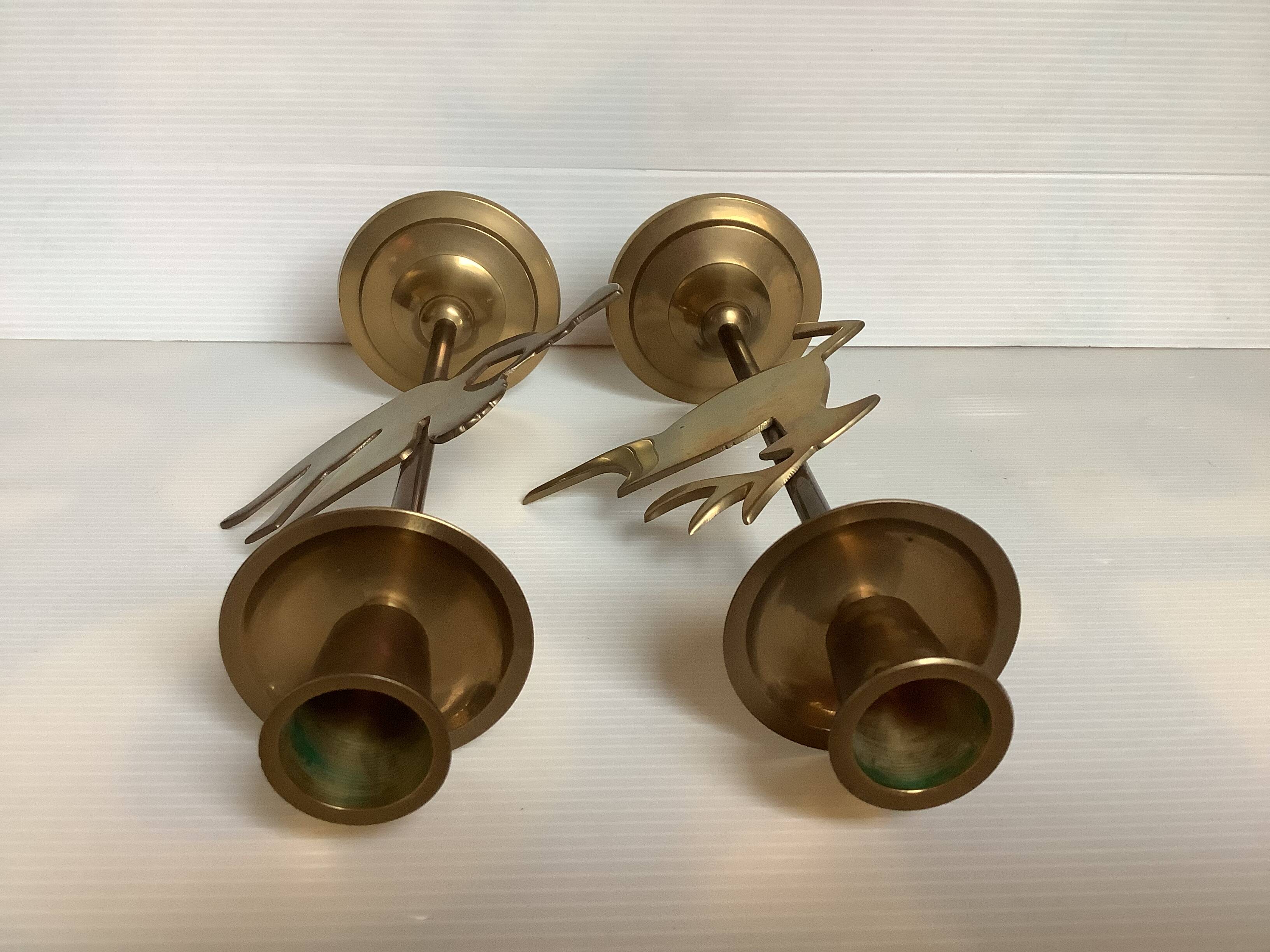 Pair of brass Christmas angel and reindeer candle holders