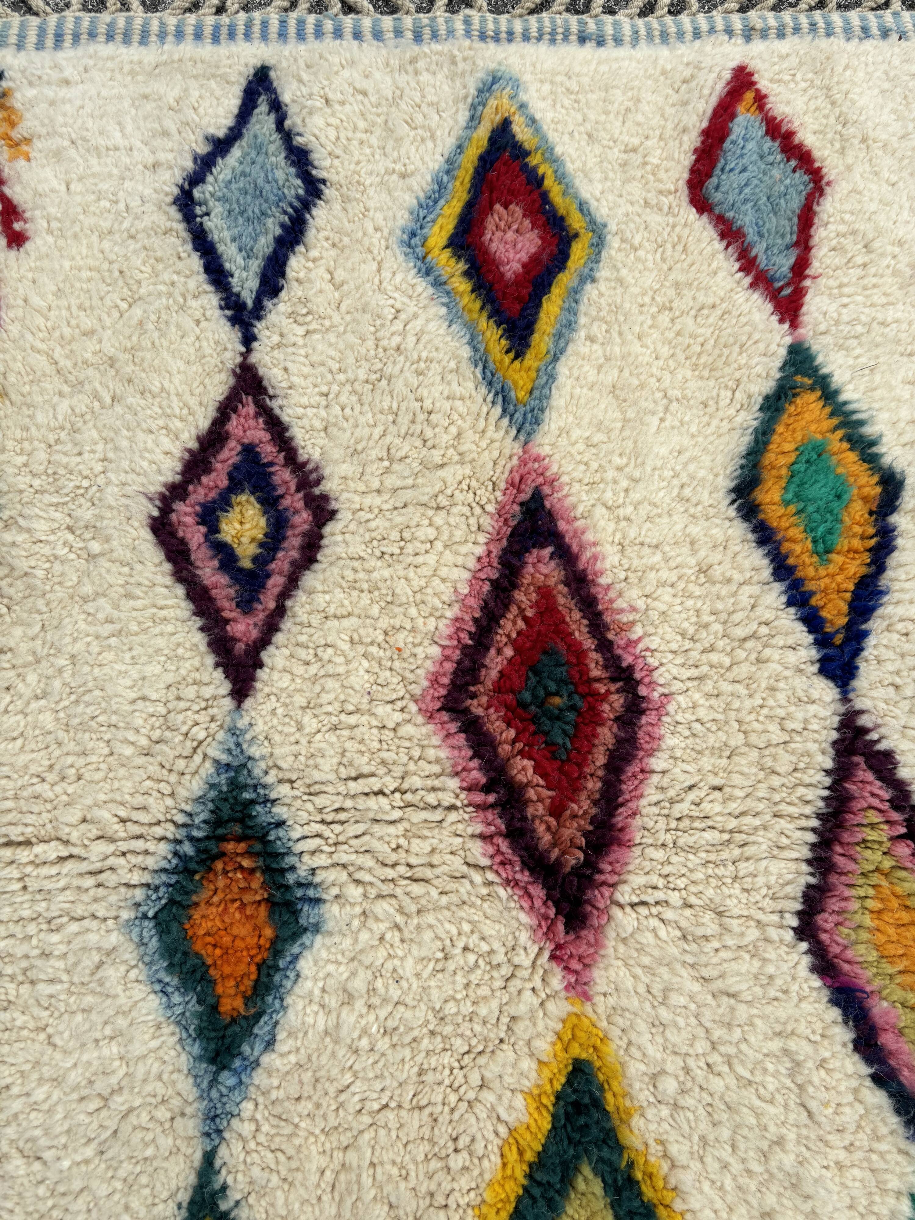 M'rirt Berber rug in cream wool with coloured patterns, 160 × 190 cm
