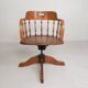 Oak office chair with a spring system and height adjustable, 1930s.