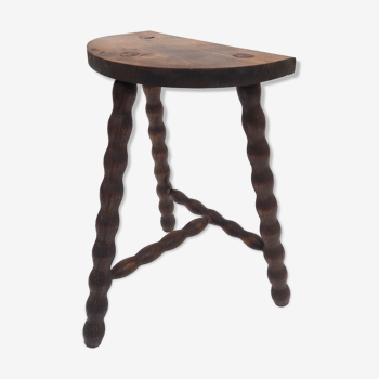 Old rustic stool in turned wood