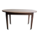 Antique wooden folding table with a patina and brass wheels.