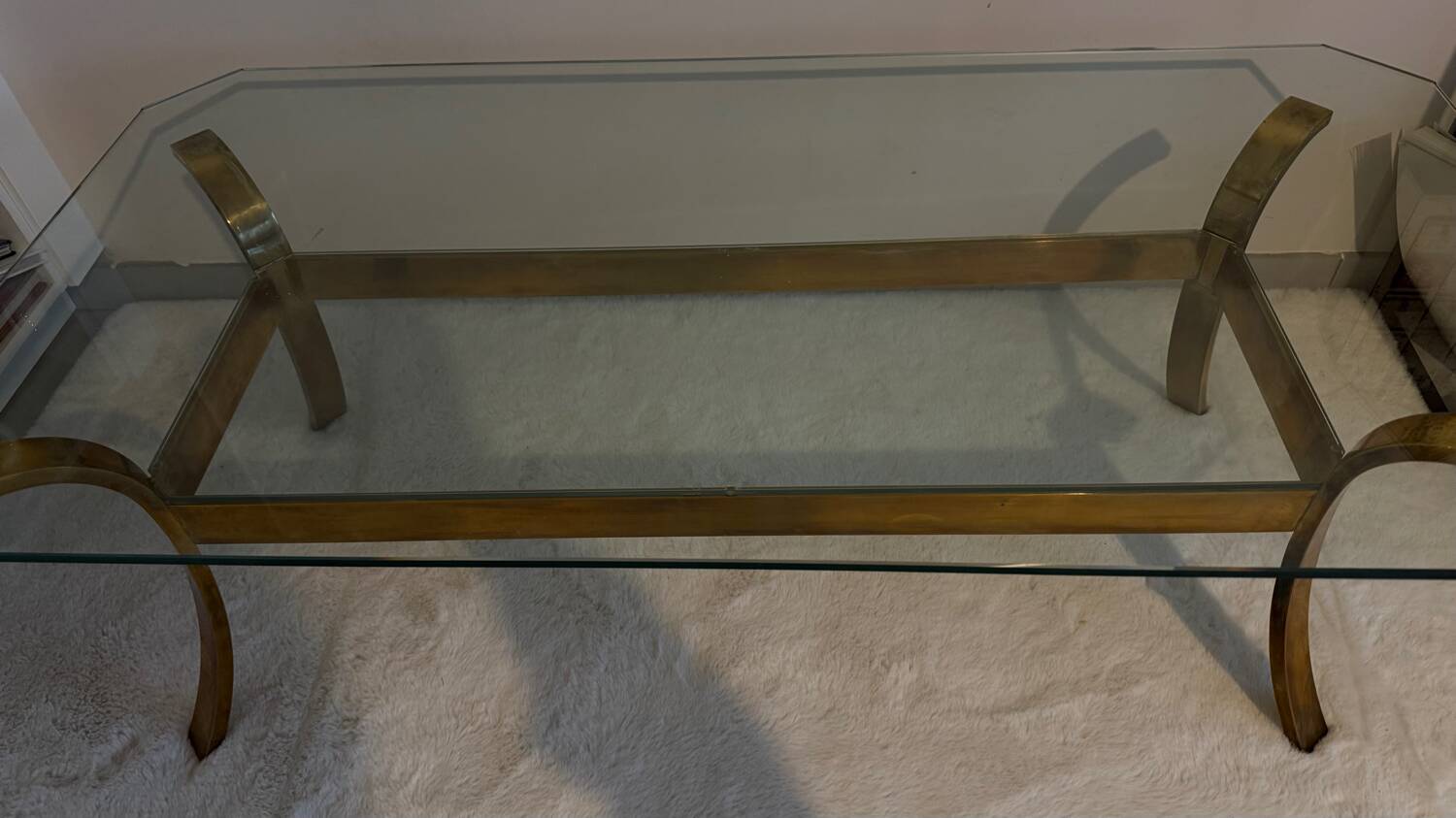 Gilt brass console table with glass top by Jacques Quinet