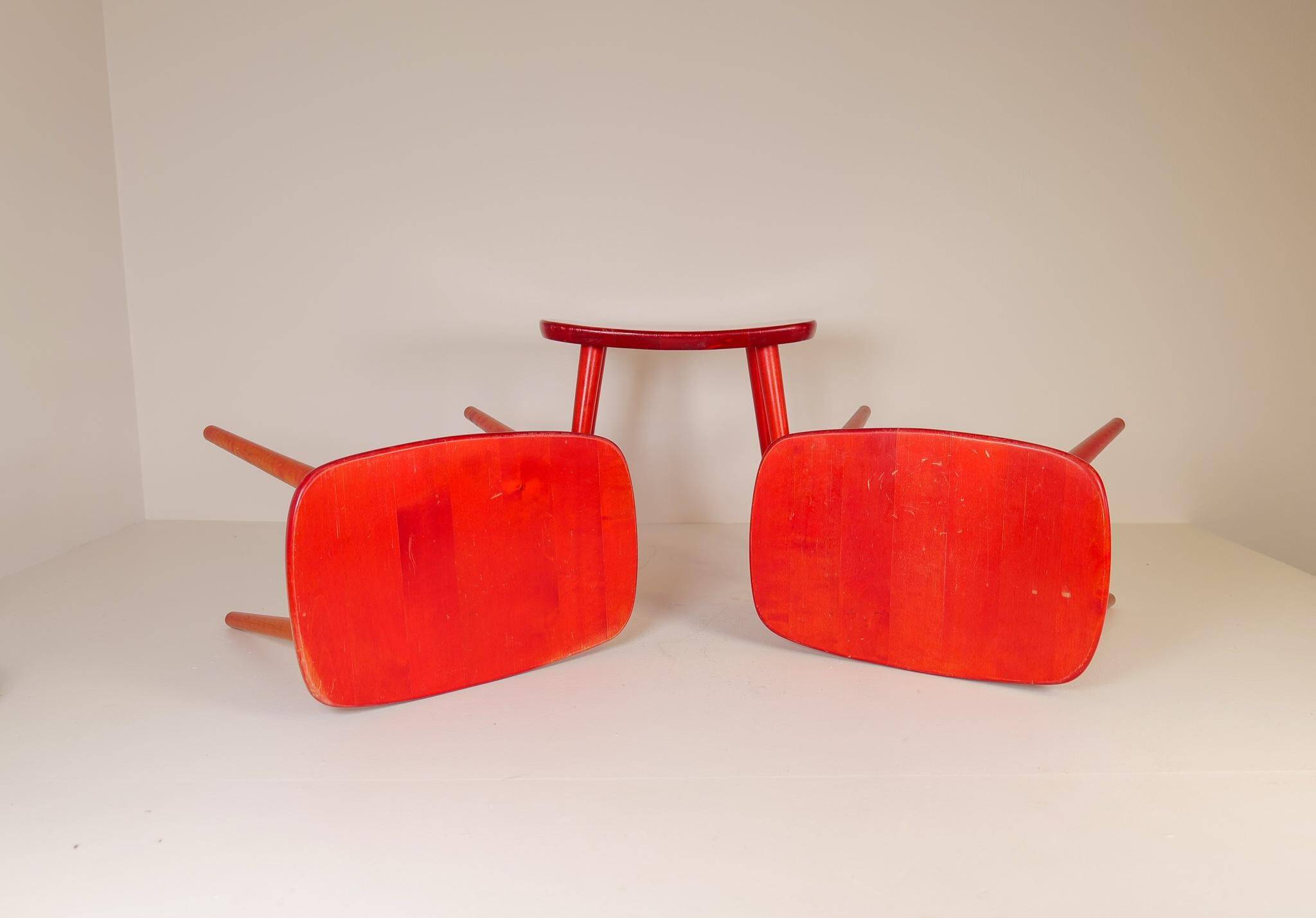 Swedish stools in red lacquered birch, Yngve Ekström "Palle", 1970s