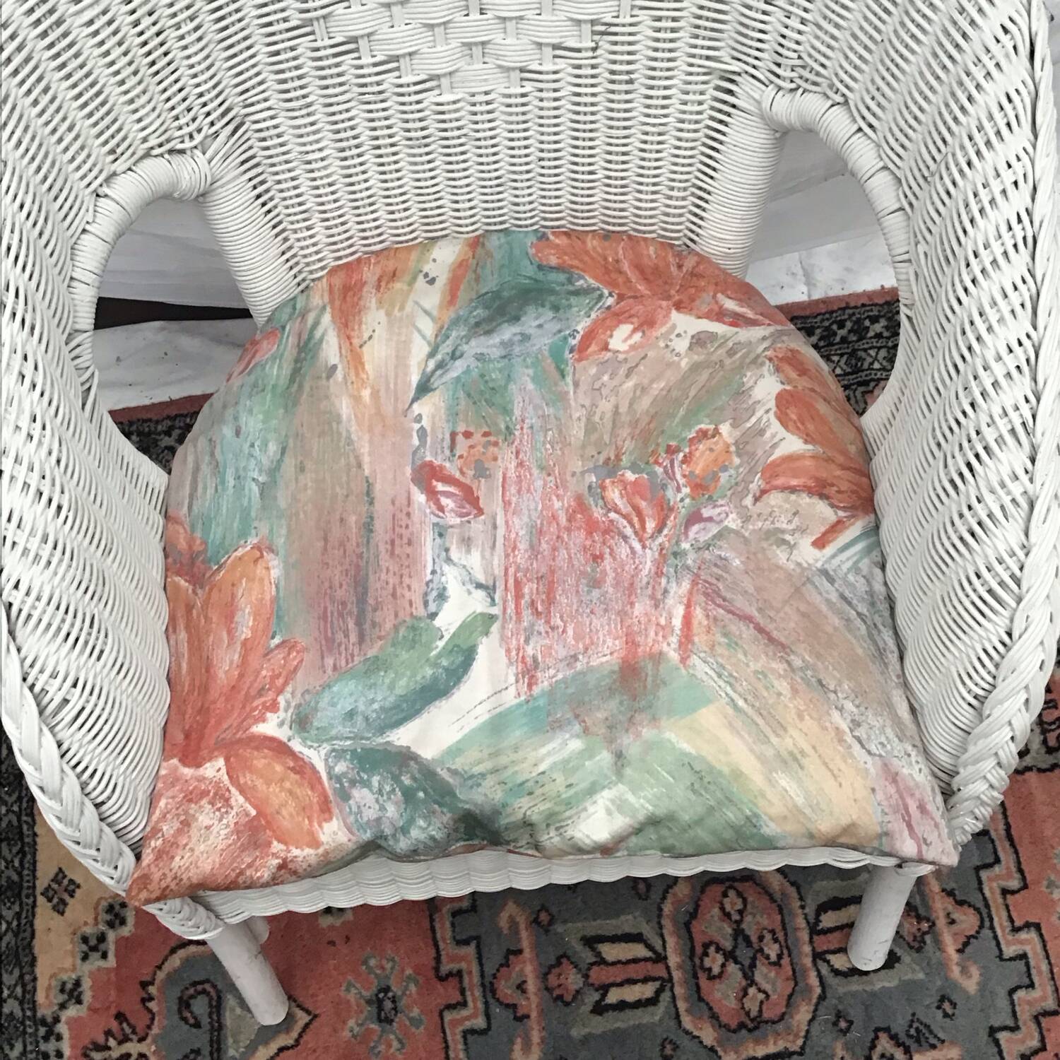 White rattan armchair with pretty vintage