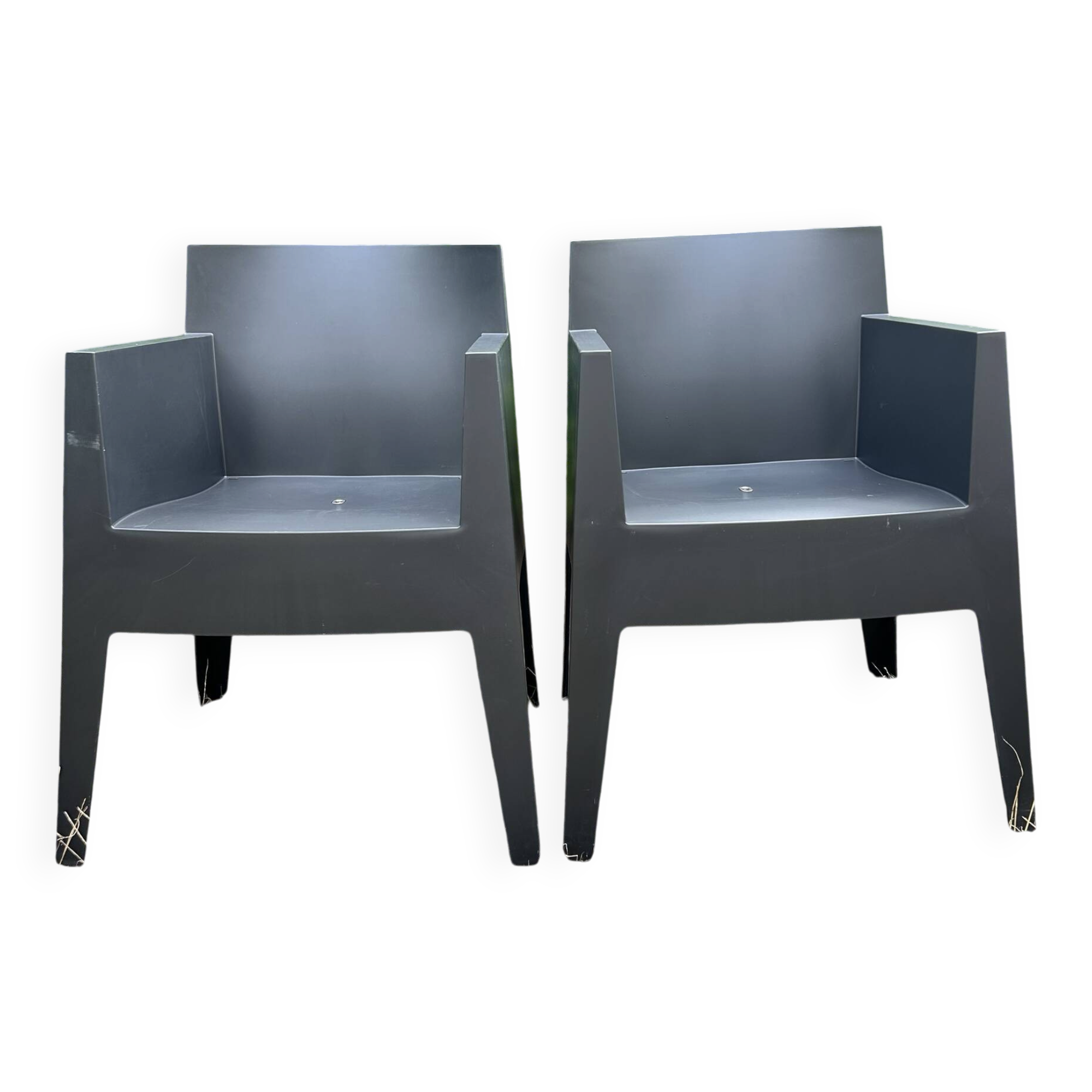 2 black Toy chairs designed by Starck