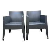 2 black Toy chairs designed by Starck