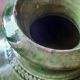 Ancient vase in glazed terracotta with green glaze.