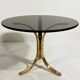 Brass and smoked glass side tables from the 1960s.
