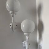 Cast iron and opaline wall lights from the 70s