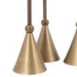 Trio of brass candlesticks by Christian de Beaumont