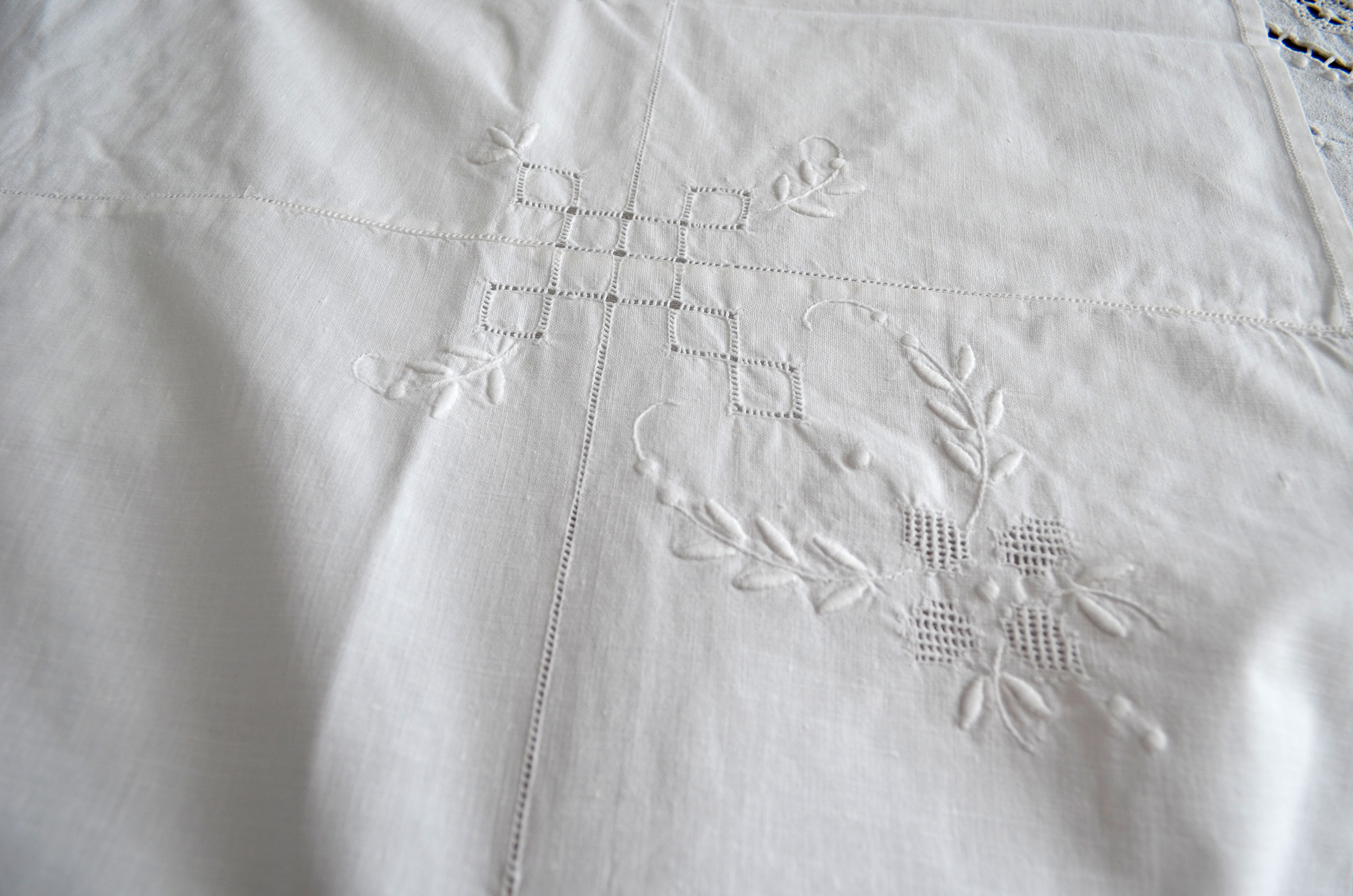 Old white tablecloth embroidered hand