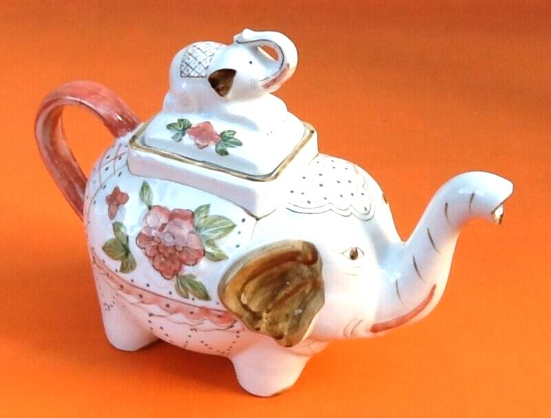 White porcelain teapot decorated with peonies elephant shape