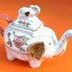 White porcelain teapot decorated with peonies elephant shape