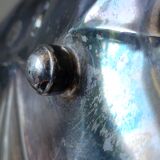 Old empty cut pocket in silver metal art nouveau in the shape of a sheet