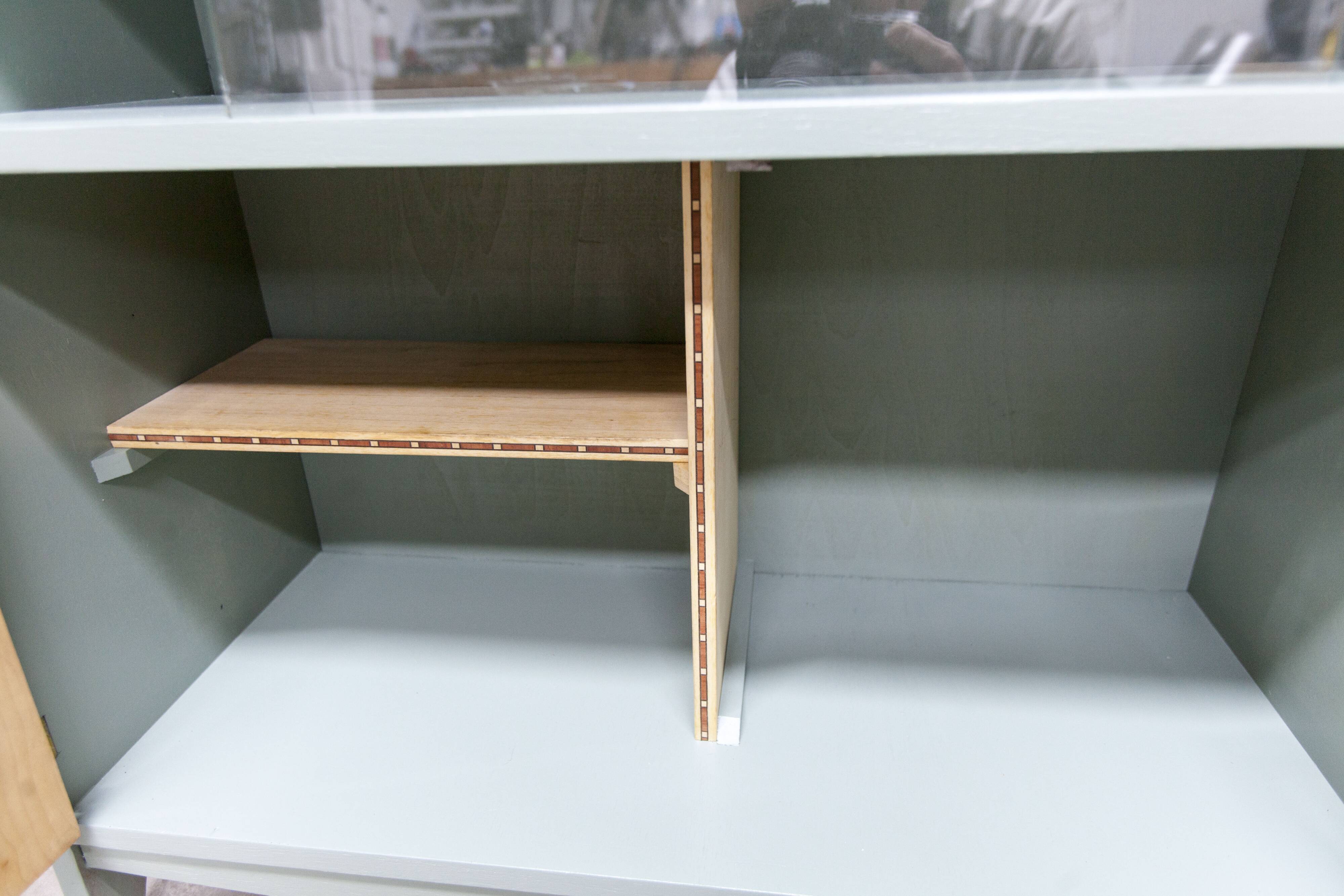 Atypical green noble 1960s low display cabinet.