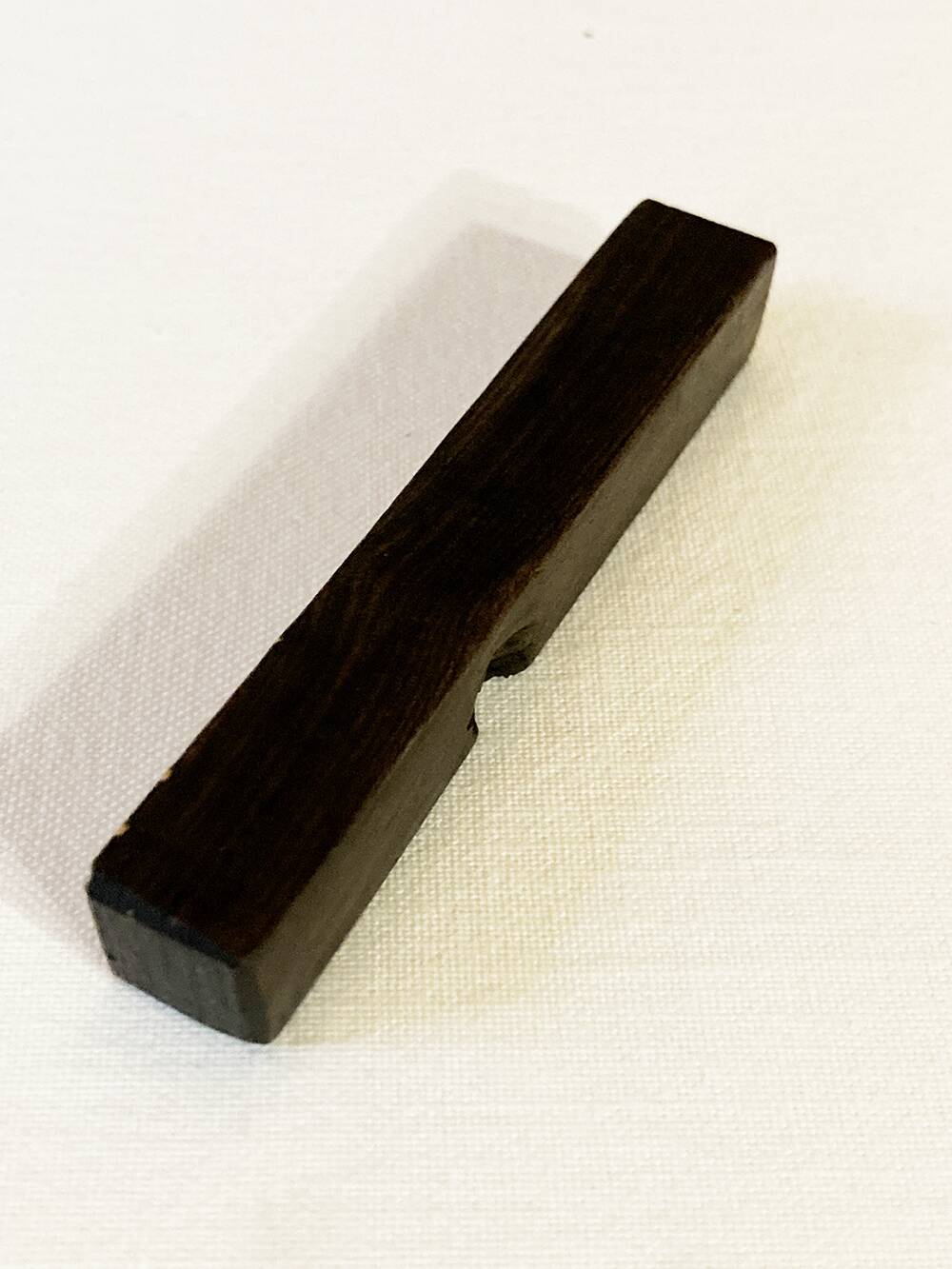 Set of 11 ebony wood knife rests with brass inlay
