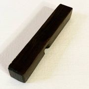 Set of 11 ebony wood knife rests with brass inlay