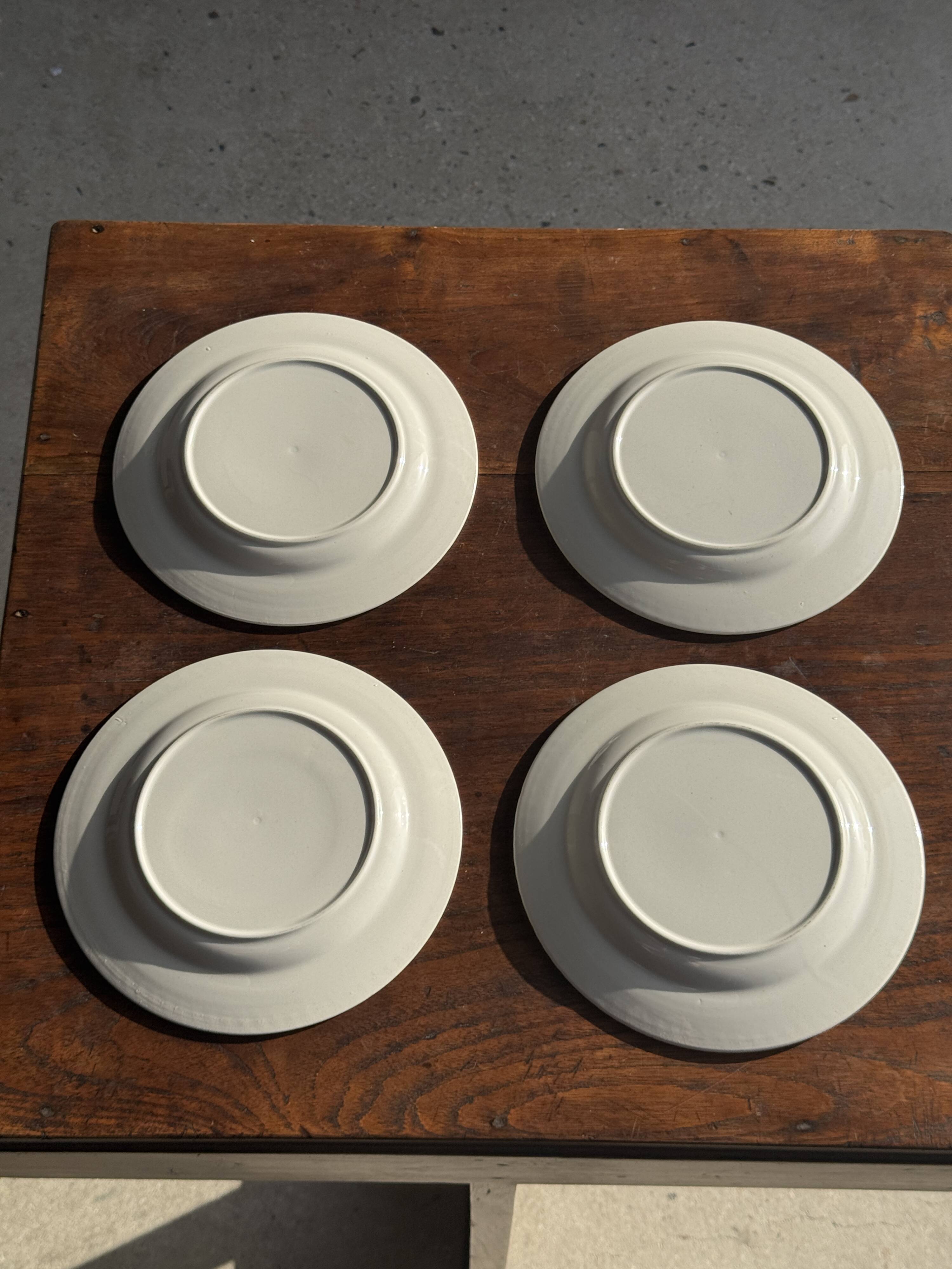 Set of 4 small dessert plates with a vintage stylised flower pattern.